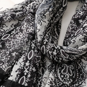 Close-up of bohemian paisley print scarf showing detailed cotton linen fabric texture