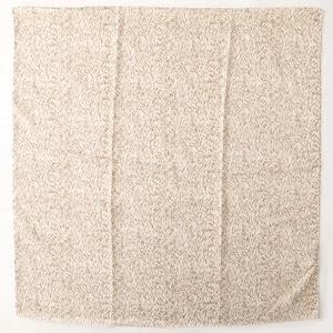 Detail of soft cotton linen scarf with brown feather print and delicate frayed edges