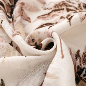 Macro shot of leaf pattern on textured cotton-linen feel fabric for winter shawl