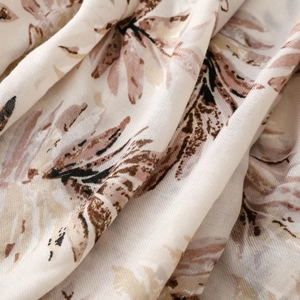 Macro detail of retro leaf patterns on breathable cotton linen blend scarf fabric