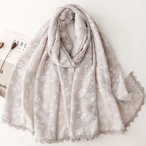 Light gray cotton linen scarf with white floral embroidery and delicate lace edges