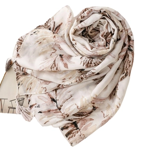 Elegant apricot leaf print scarf with tassels made of soft cotton and linen feel fabric