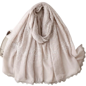 Sciarpa beige in cotone e lino con ricamo floreale e bordo in pizzo all'uncinetto