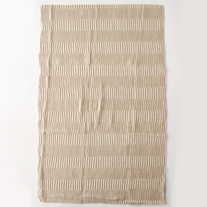 Macro detail of beige pleated fabric with soft vertical texture and silk-like finish