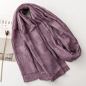 Detail of purple pleated scarf showing crinkle texture and natural wavy edges