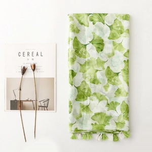 Elegant green ginkgo leaf print scarf with tassels for bohemian travel style