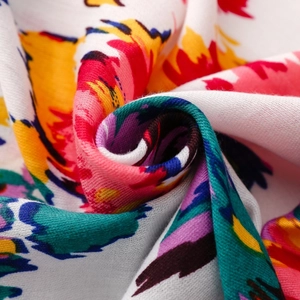 Macro shot of colorful artistic graffiti print scarf showing soft texture and fine fabric