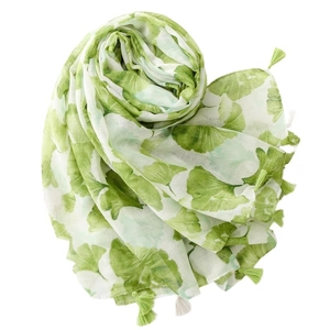 Elegant white shawl with green ginkgo leaf print and delicate fringe tassels
