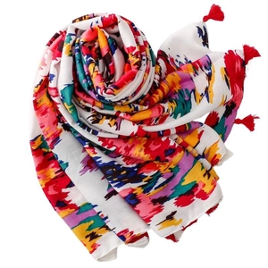 Artistic graffiti print scarf with red tassels and colorful abstract splatter patterns