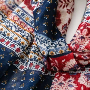 Macro detail of Bohemian cotton linen scarf featuring ethnic geometric floral print and texture