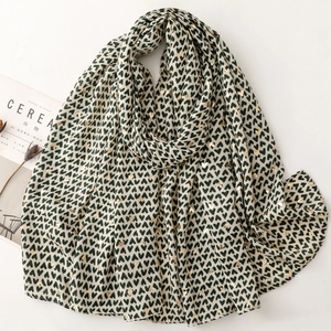 Elegant cream scarf with black and gold foil heart prints for a stylish winter look