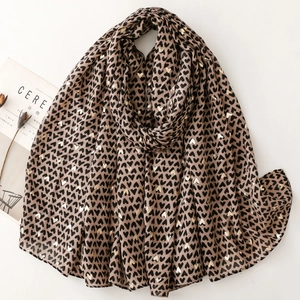 Lightweight scarf with heart prints and gold foil details on a light brown fabric base
