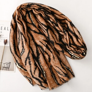 Close-up of zebra pattern scarf with soft raw edges and golden foil texture