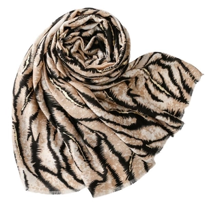 Linen feel scarf with zebra patterns and gold foil details featuring fringed edges