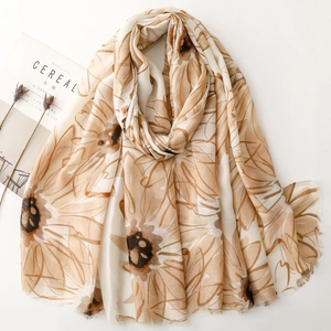 Elegant floral print satin scarf for women with fringe details on a minimalist background