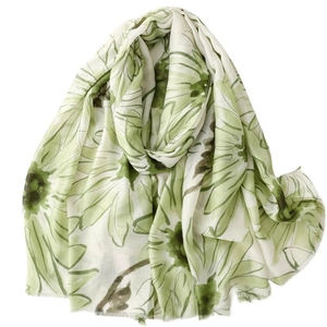 Lightweight white scarf with green daisy floral print and soft frayed edges for women