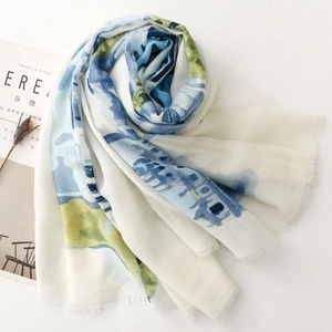 Detailed texture of watercolor floral silk scarf with frayed edges on a minimalist background