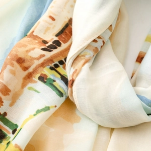 Macro shot of lightweight satin scarf featuring an abstract Roman Holiday scenery print