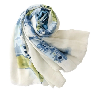 Abstract blue and green floral print scarf with delicate fringed edges on white background