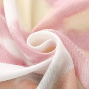 Macro detail of soft macaron striped scarf showing fine herringbone twill weave texture