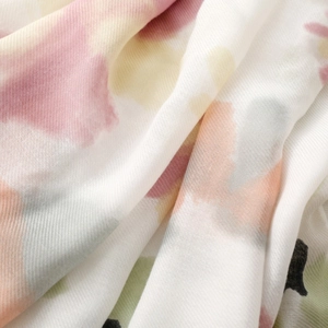 Macro shot of diagonal twill texture on a watercolor abstract pattern scarf fabric