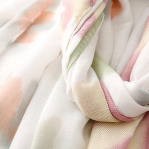Detailed close-up of macaron color palette watercolor print scarf with soft twill weave texture