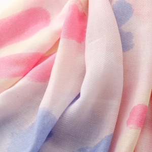 Detail of soft watercolor tie-dye texture on pink and blue pashmina scarf fabric
