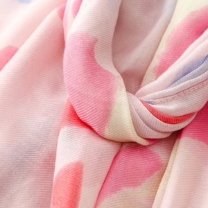Detailed macro view of the soft pink and white gradient twill weave fabric texture