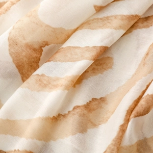 Detailed macro view of soft zebra pattern satin fabric showing light airy texture and print