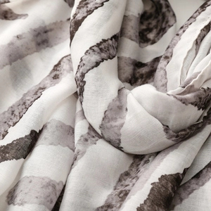 Detailed macro view of soft zebra pattern satin fabric with artistic ink texture