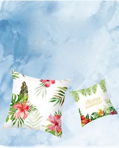 Detail of red hibiscus and tropical palm leaf print on white peach skin pillow covers