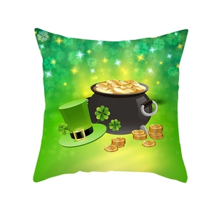 Detail of St. Patrick's Day cushion cover with gold coins and a green leprechaun hat