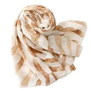 Lightweight ivory scarf with brown zebra tie-dye pattern and frayed edge details