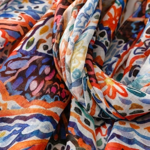 Close-up of bohemian paisley floral pattern on lightweight breathable woven fabric