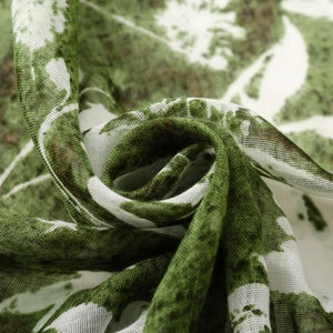 Detail of vintage floral scarf with grass green abstract print and breathable linen texture