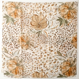 Detail of thin satin scarf with floral and leopard print mix on a white background
