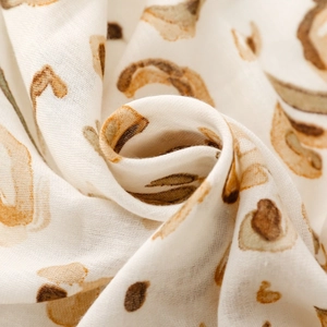 Detailed close-up of the leopard print cotton scarf showing soft texture and fabric weave
