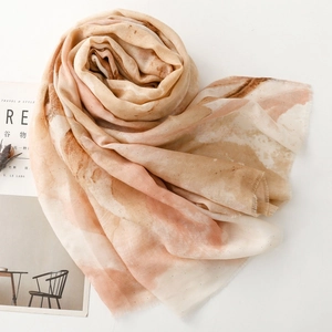 Detail of iris marble silk scarf with gold foil accents and soft fringed edges
