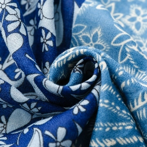 Macro detail of navy paisley floral fabric with soft texture for winter scarf and shawl