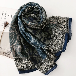 Detail of vintage paisley and floral print scarf with a bohemian aesthetic design