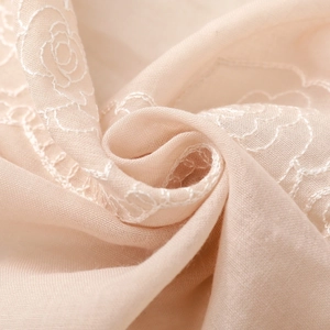 Detailed view of rose embroidery on light beige cotton-linen blend ethnic scarf shawls