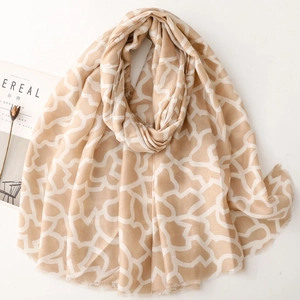 Elegante sciarpa in cotone e lino beige e bianca con motivi geometrici