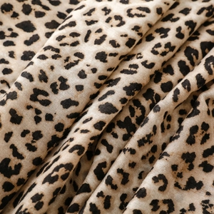 Detail of leopard print fabric with soft pleats and lightweight cotton-linen texture