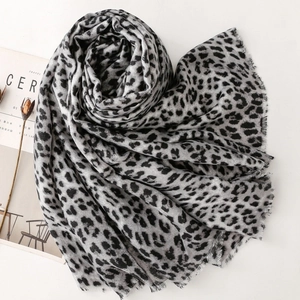 Leopard print cotton linen scarf with frayed edges in a stylish black and gray pattern