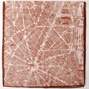 Detail view of the vintage Paris city map print on a square silk scarf with rolled edges