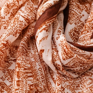 Close-up of soft hand-painted vintage map print scarf with high-quality fabric texture