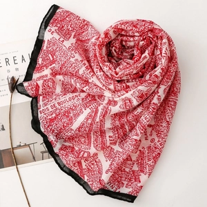 Detailed view of red and white vintage map print scarf with black borders and French text
