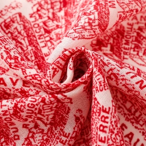 Close-up of red and white Toile de Jouy floral print on soft cotton linen scarf