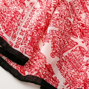 Macro shot of cotton linen scarf featuring vintage French map print and red borders