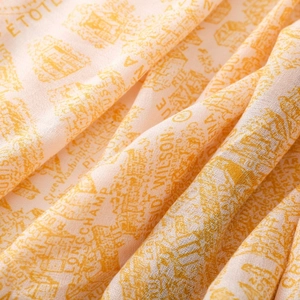 Macro shot of lightweight fabric scarf showing detailed orange French building prints
